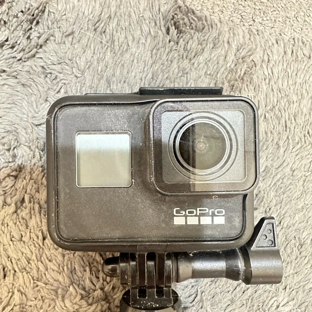 Go pro black 7, case, battery, and stick